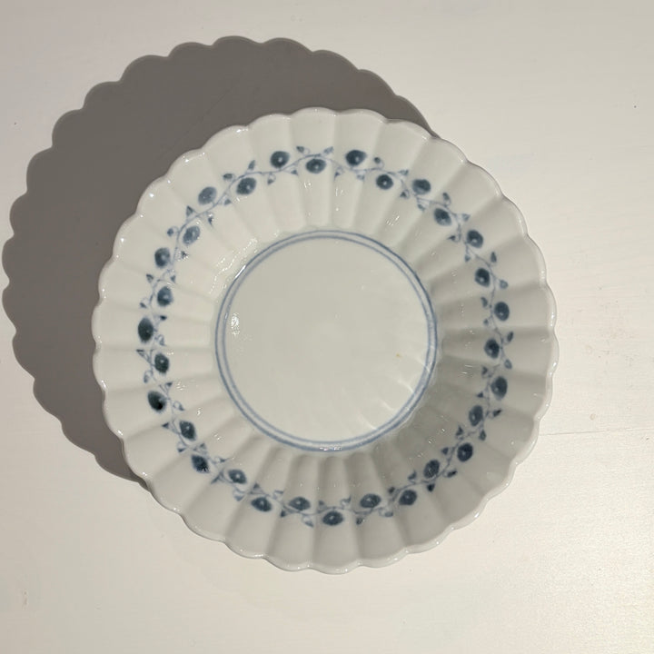 Small blue and white bowl with fruit and flower motif